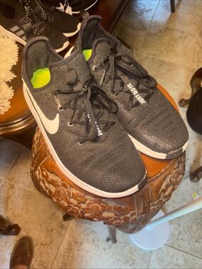 Nike Black Running Sneakers with White Swoosh and Neon Green Lining